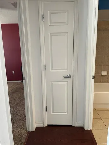 a kitchen with wooden cabinets and a stove top oven