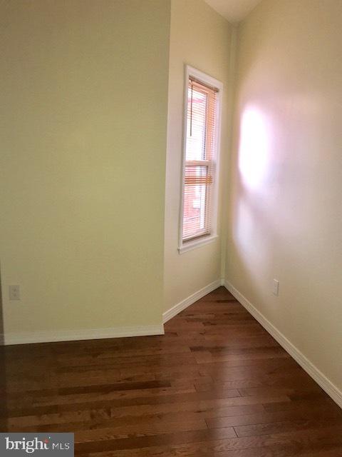 767 South 4th Street, Unit 3 Philadelphia, PA 19147 - Photo 3 of 10 an empty room with wooden floor and windows