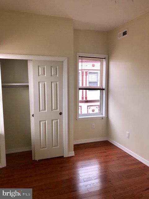 767 South 4th Street, Unit 3 Philadelphia, PA 19147 - Photo 6 of 10 an empty room with wooden floor and windows