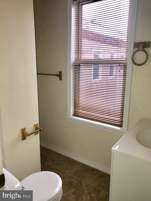 767 South 4th Street, Unit 3 Philadelphia, PA 19147 - Photo 7 of 10 a bathroom with a toilet a sink and a window