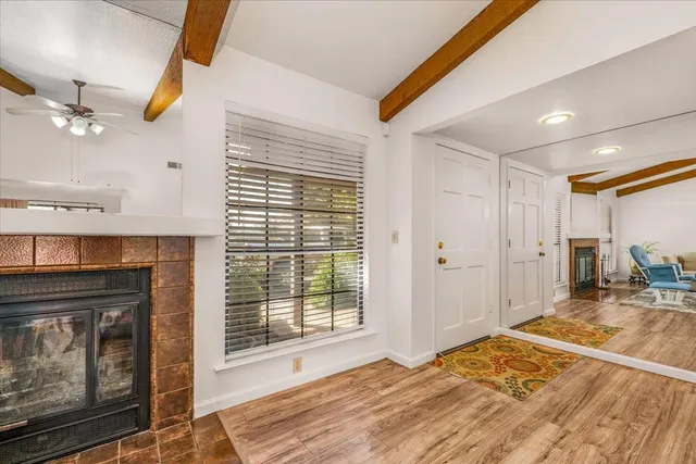 a bedroom with a bed and a fireplace