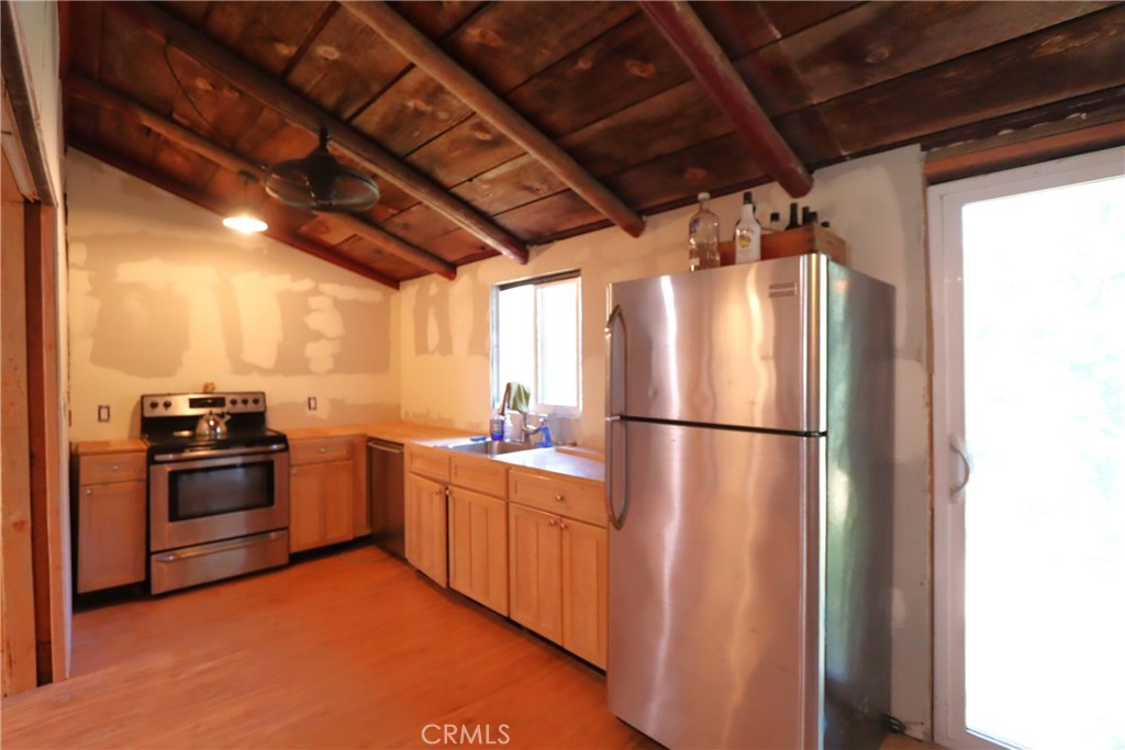 10354 Mulberry Street Middletown, CA 95461 - Photo 13 of 18 a kitchen with stainless steel appliances a refrigerator and a stove