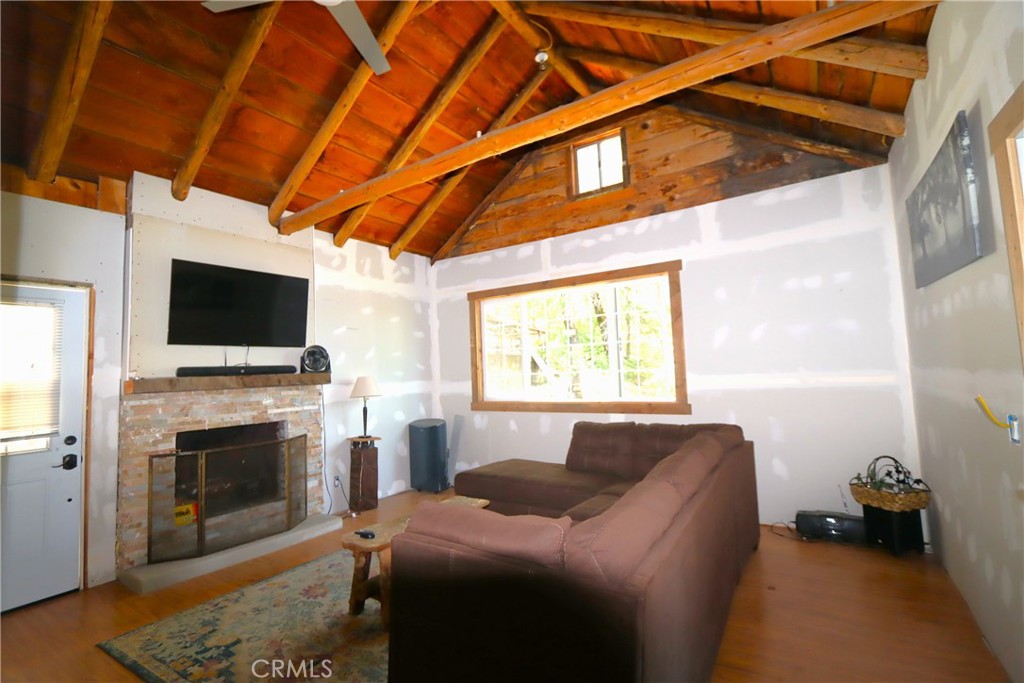 10354 Mulberry Street Middletown, CA 95461 - Photo 17 of 18 a living room with furniture a flat screen tv and a fireplace