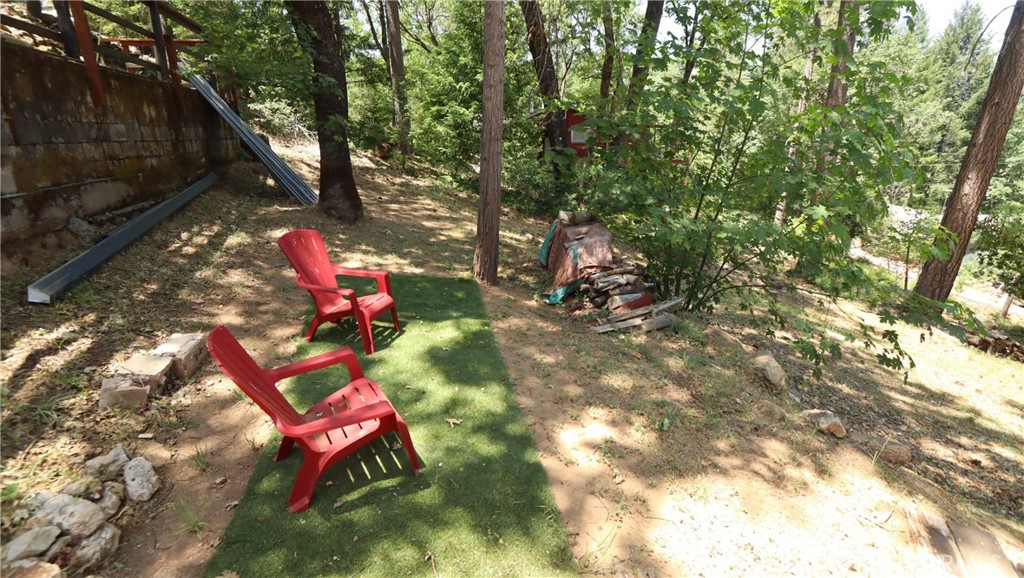10354 Mulberry Street Middletown, CA 95461 - Photo 4 of 18 a backyard of a house with table and chairs