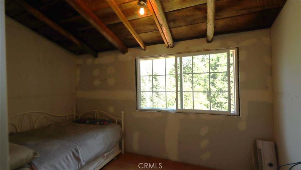 10354 Mulberry Street Middletown, CA 95461 - Photo 9 of 18 a bed room with a bed and a window