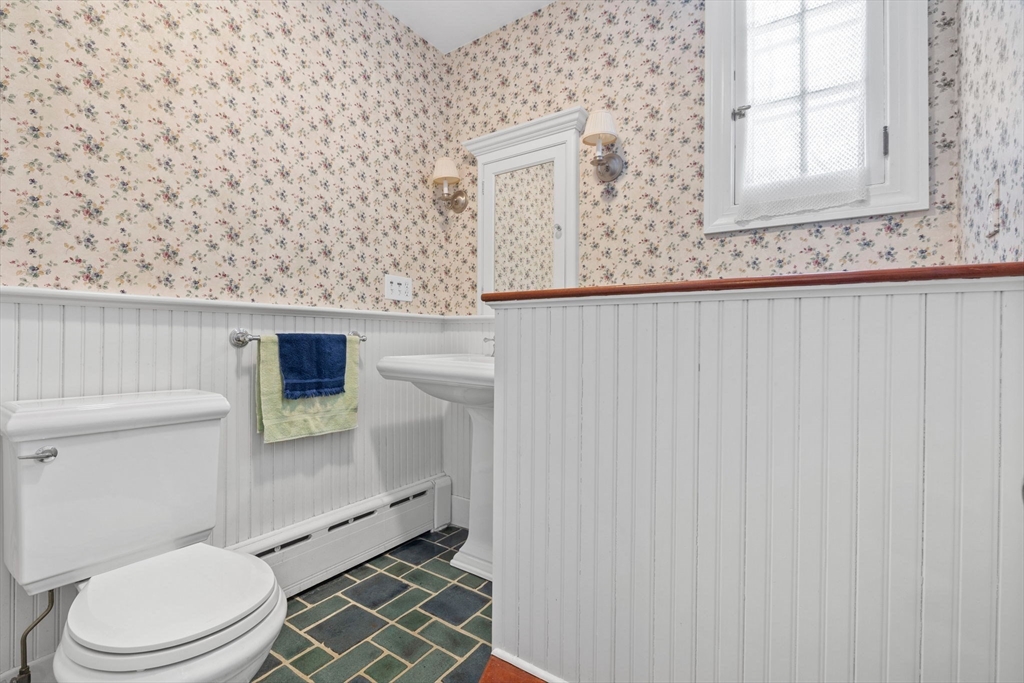 27 Locust Avenue Lexington, MA 02421 - Photo 12 of 38 a bathroom with a toilet and a sink