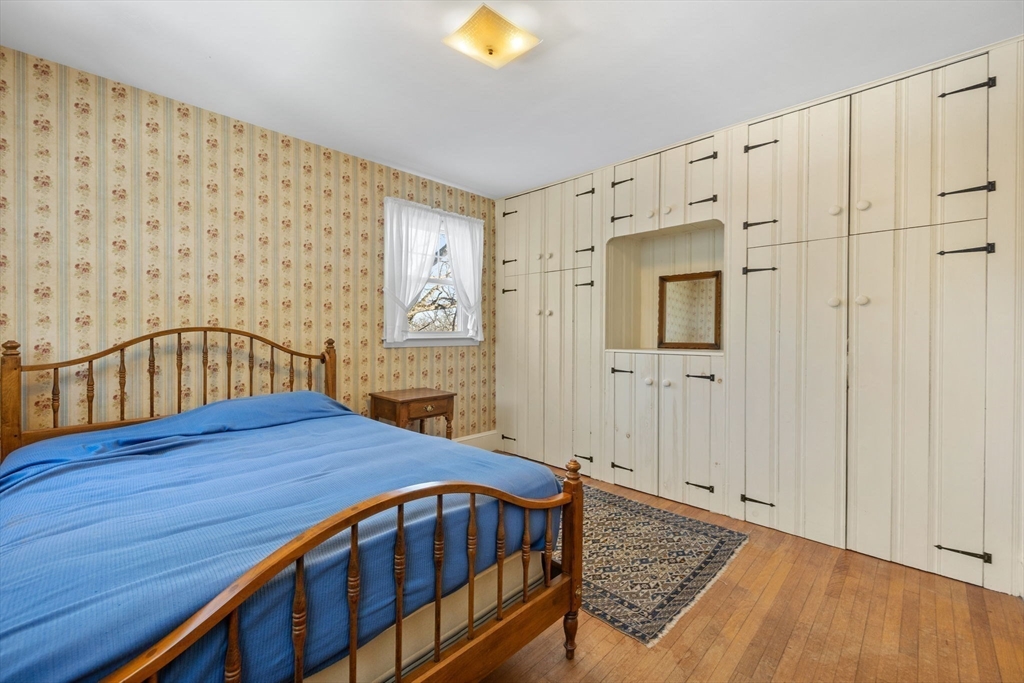 27 Locust Avenue Lexington, MA 02421 - Photo 20 of 38 a bedroom with a bed and a table