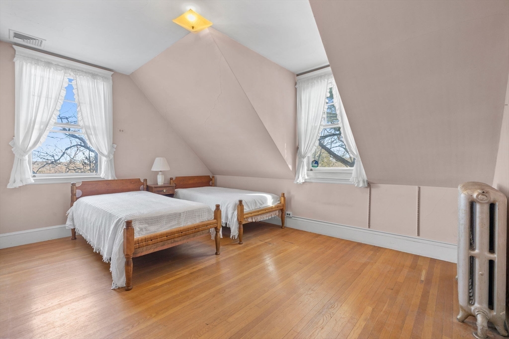 27 Locust Avenue Lexington, MA 02421 - Photo 22 of 38 a bedroom with furniture and a window