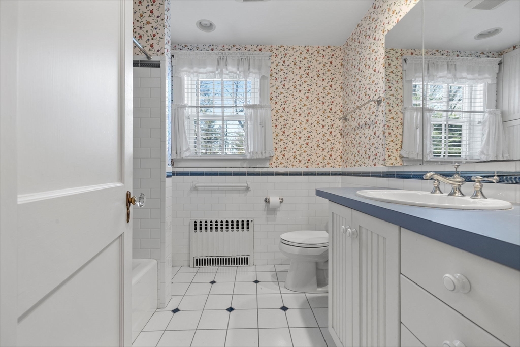 27 Locust Avenue Lexington, MA 02421 - Photo 23 of 38 a bathroom with a sink toilet and shower