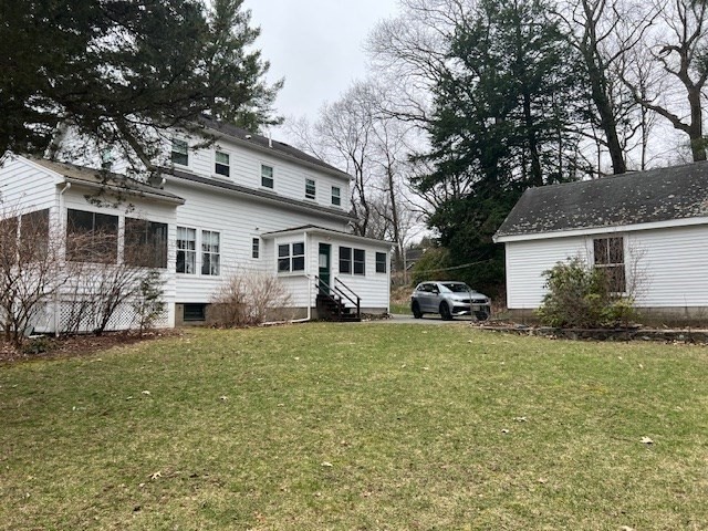 27 Locust Avenue Lexington, MA 02421 - Photo 29 of 38 a front view of a house with a garden