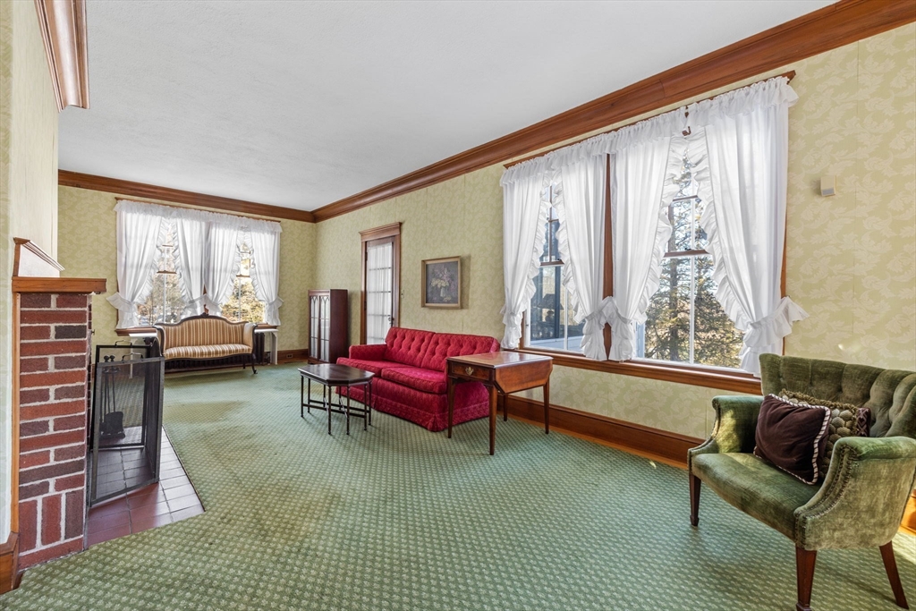27 Locust Avenue Lexington, MA 02421 - Photo 4 of 38 a living room with furniture and a large window