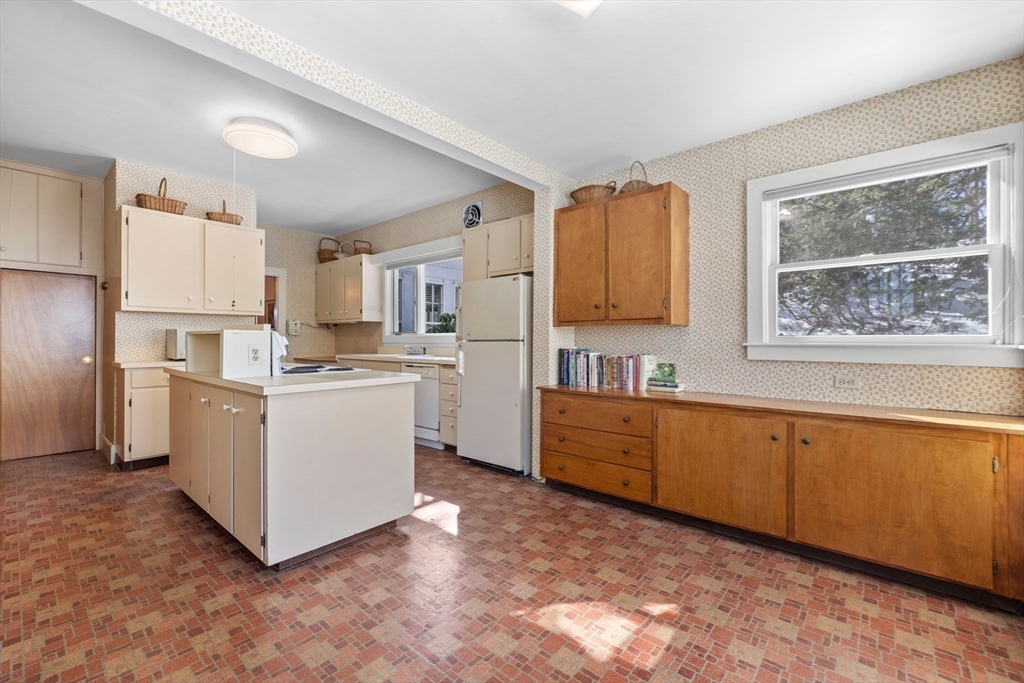 27 Locust Avenue Lexington, MA 02421 - Photo 7 of 38 a kitchen with cabinets and window
