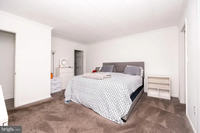 a bedroom with a bed and a cabinets