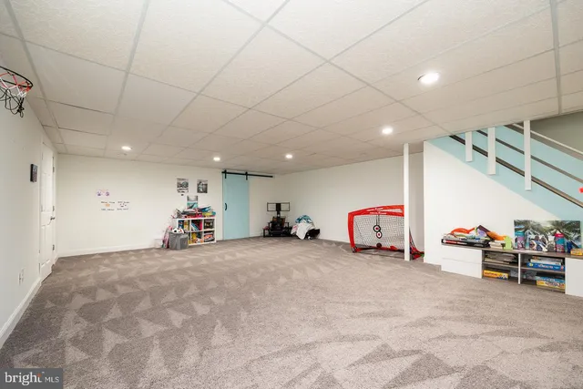 a white toilet sitting next to a bathroom sink