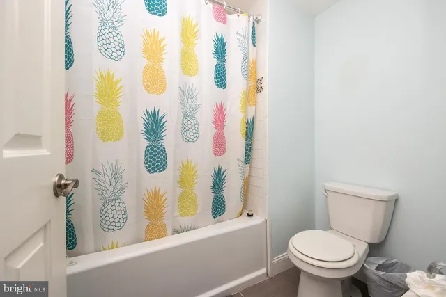 a view of a hallway with workspace and a window