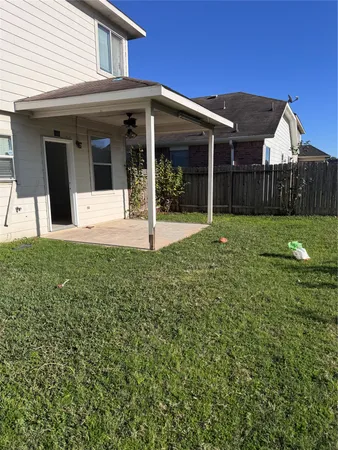 a view of a house with a yard and porch