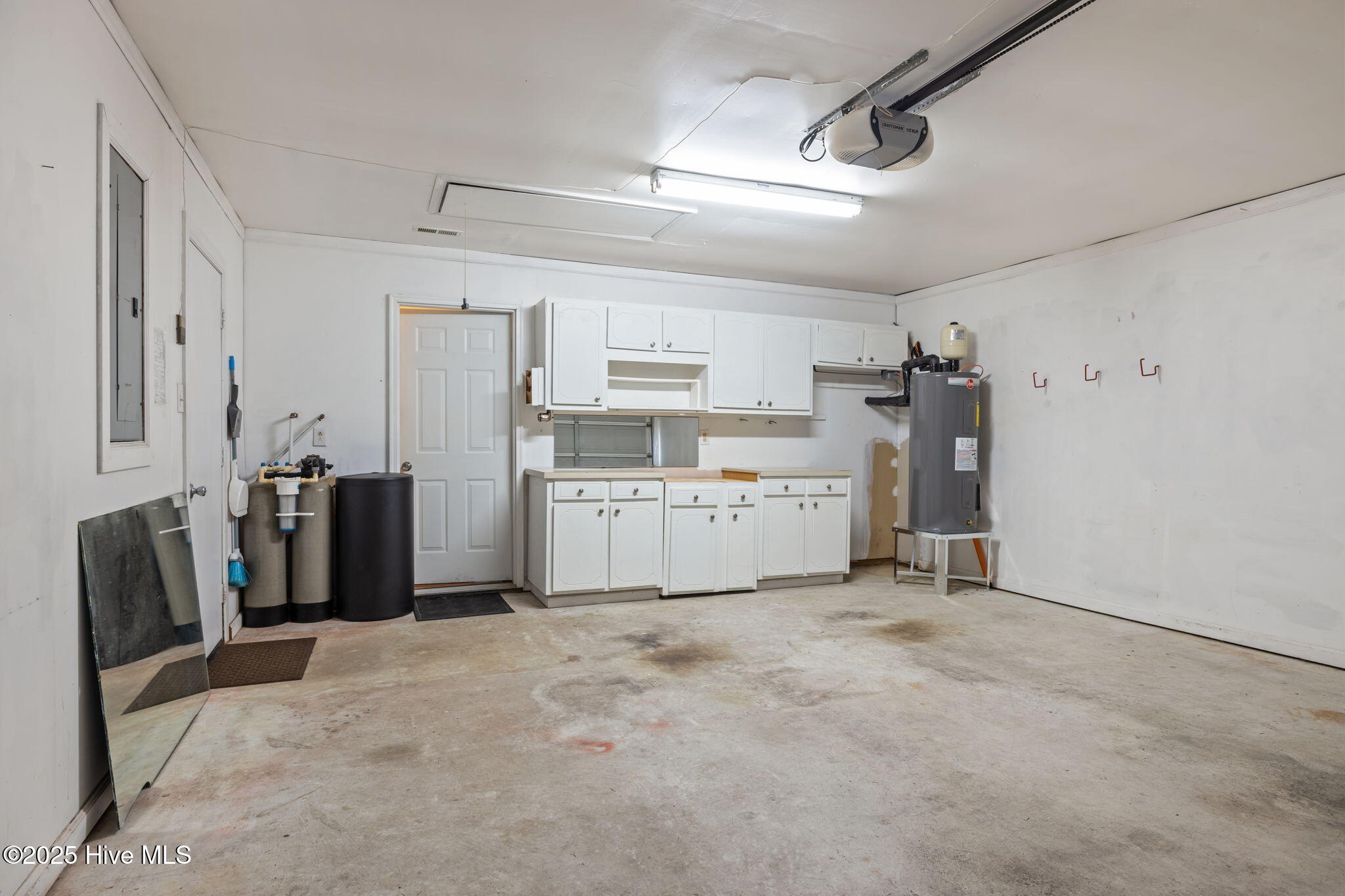 608 Barbour Road Morehead City, NC 28557 - Photo 26 of 41 House side of garage with cabinets