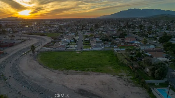 a view of a town with mountains in the background