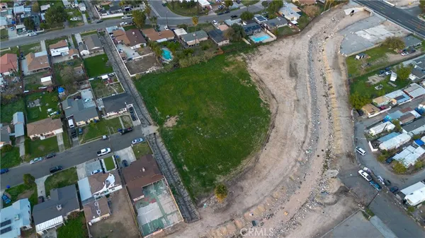 an aerial view of multiple houses with yard