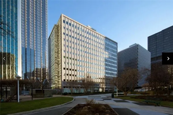 a view of a building with a yard