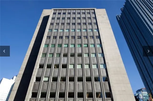 a view of bedroom with wooden floor