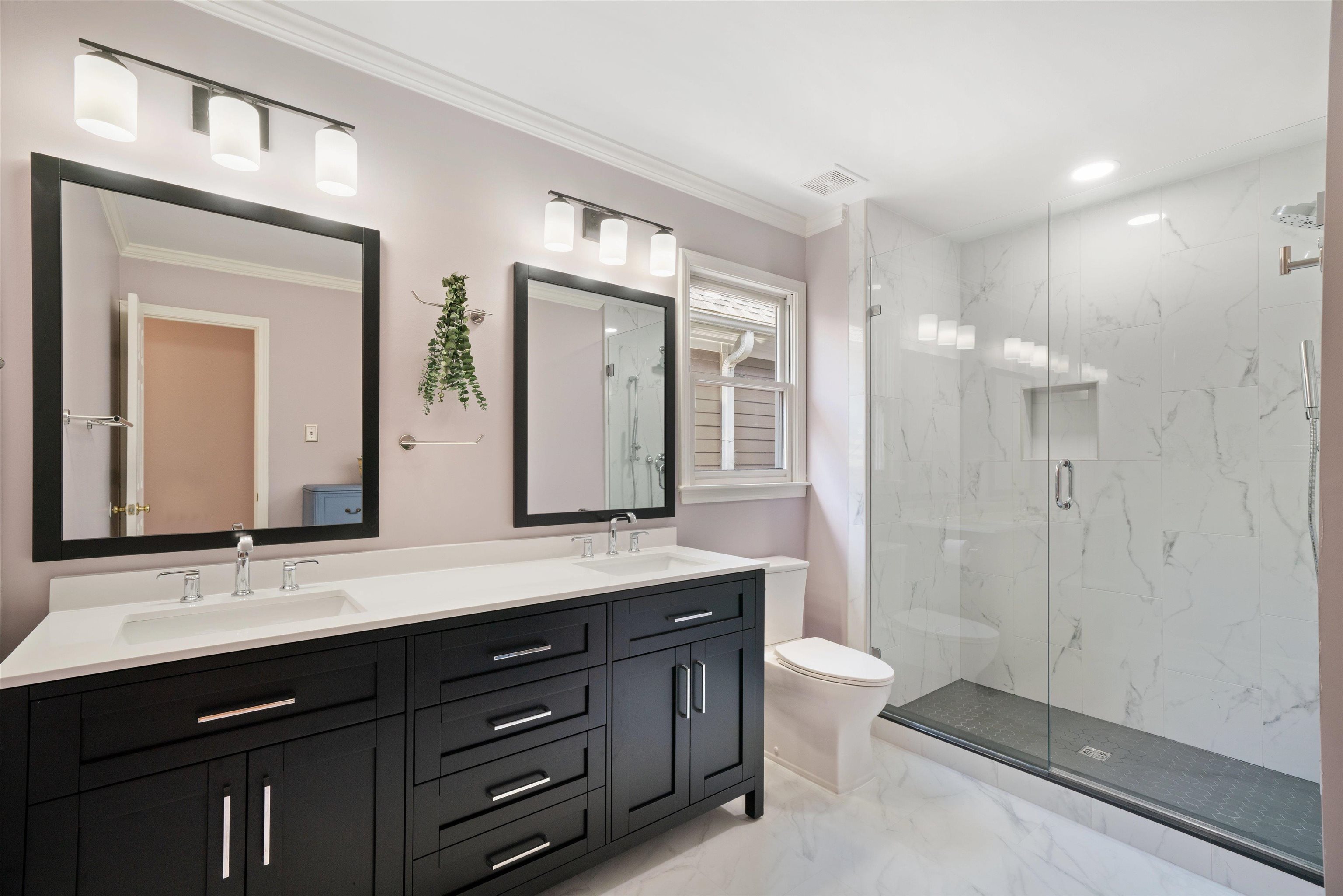 1005 River Currents Drive Memphis, TN 38103 - Photo 18 of 37 a bathroom with a double vanity sink and a mirror