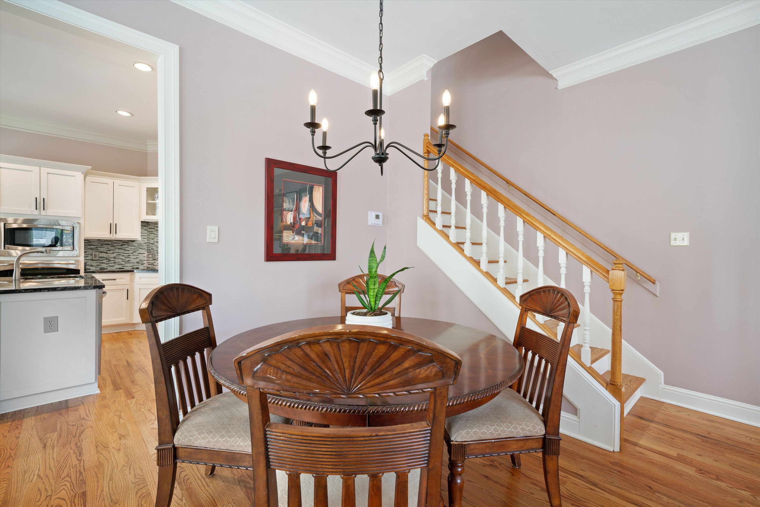 1005 River Currents Drive Memphis, TN 38103 - Photo 7 of 37 a view of a dining room with furniture and wooden floor