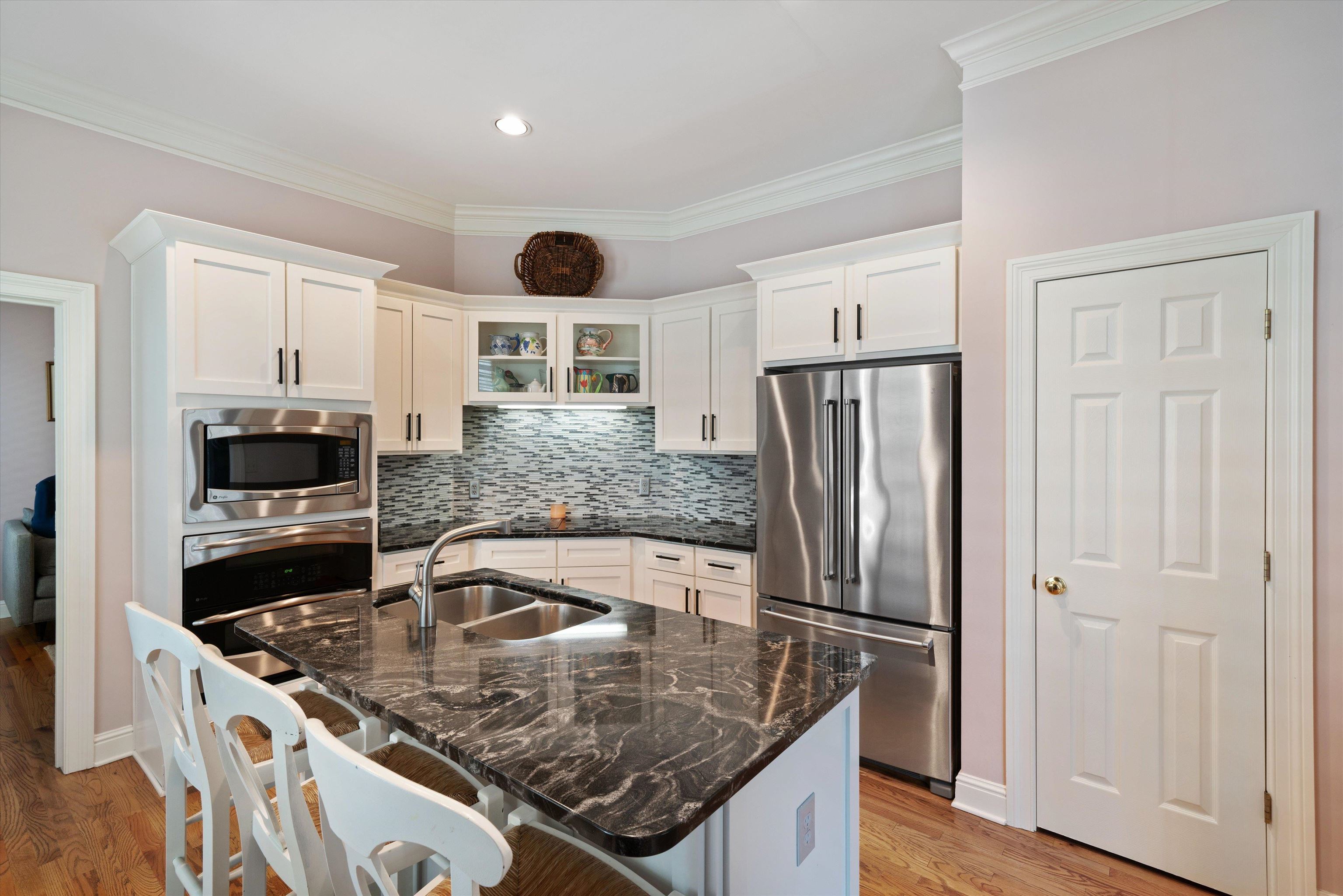 1005 River Currents Drive Memphis, TN 38103 - Photo 8 of 37 a kitchen with stainless steel appliances granite countertop a sink a stove and a refrigerator