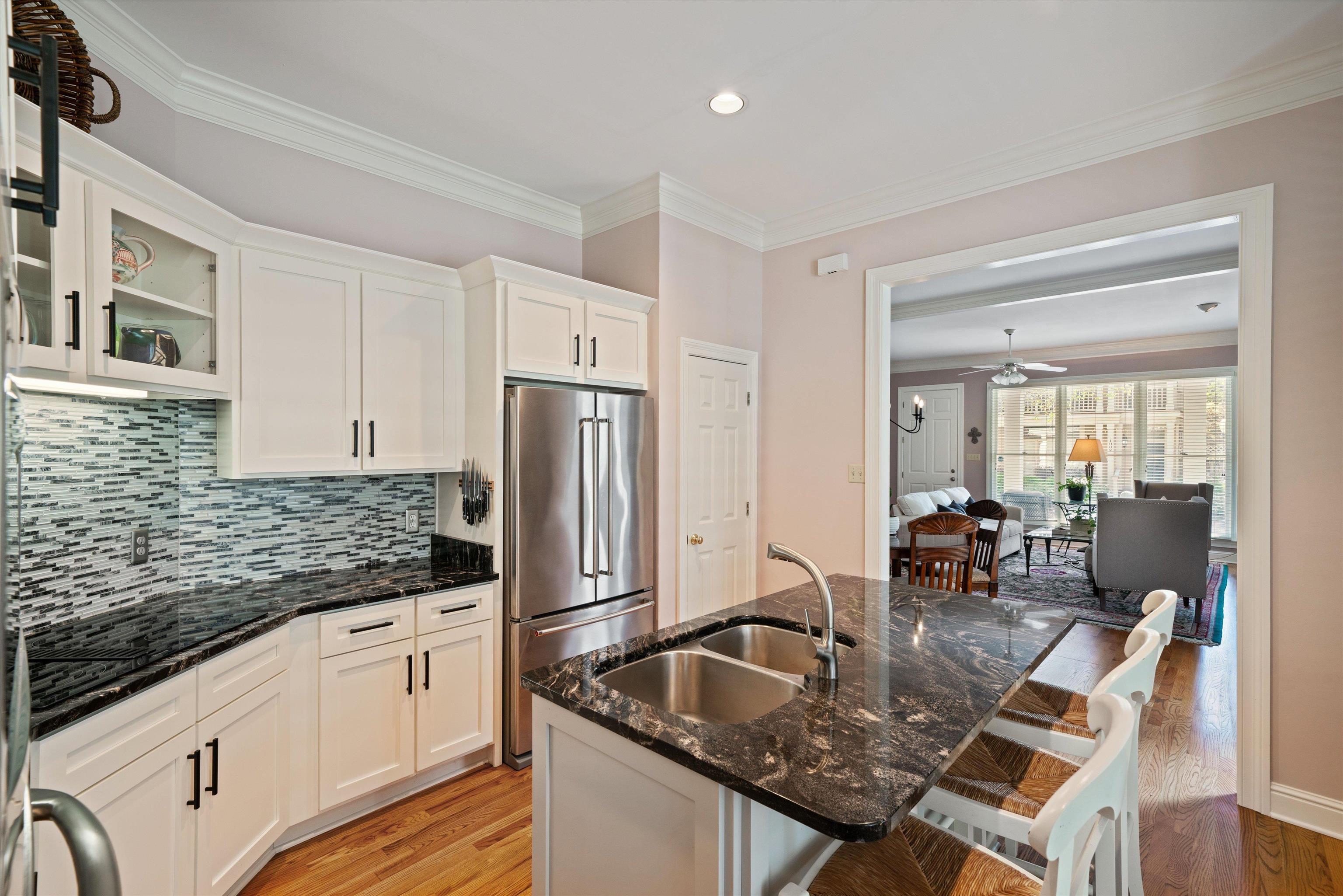 1005 River Currents Drive Memphis, TN 38103 - Photo 9 of 37 a kitchen with stainless steel appliances granite countertop a sink refrigerator and cabinets