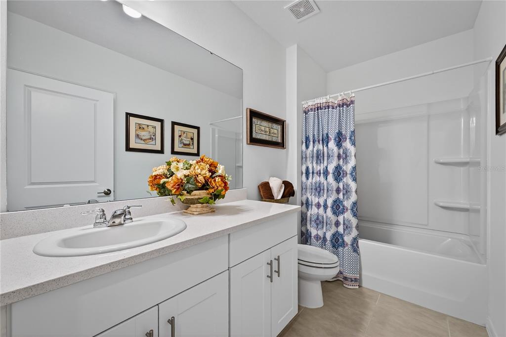 317 Riverfront Way Edgewater, FL 32141 - Photo 12 of 63 a bathroom with a sink a toilet and shower