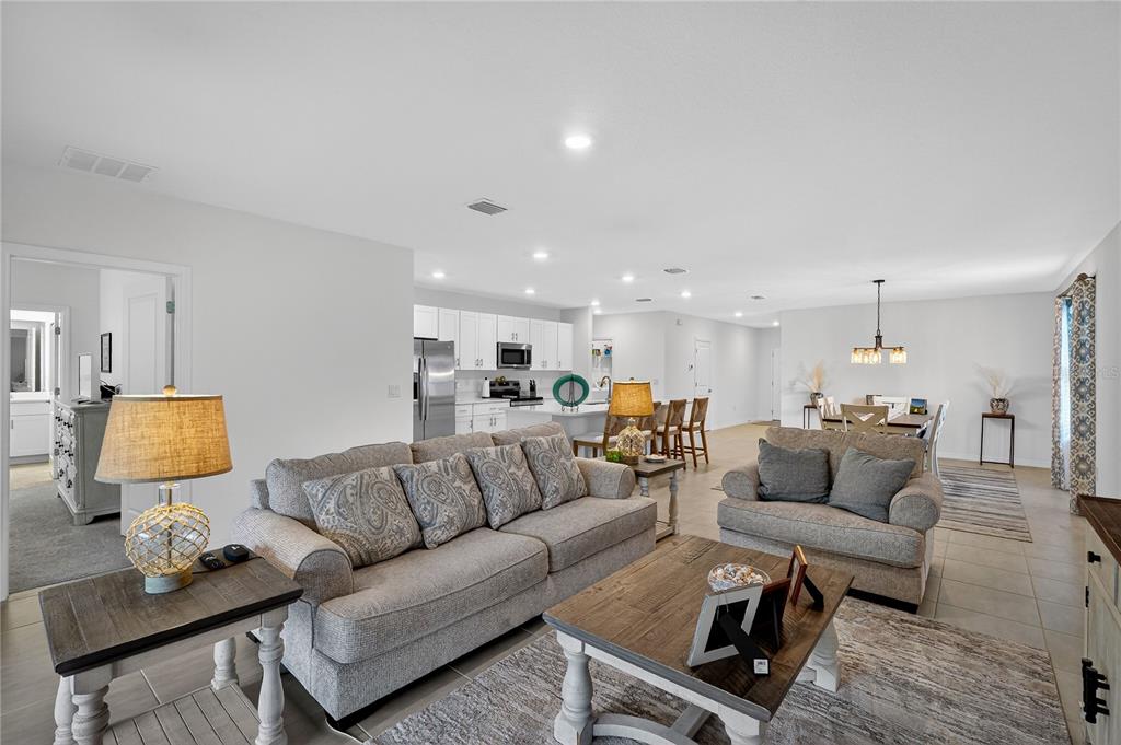 317 Riverfront Way Edgewater, FL 32141 - Photo 21 of 63 a living room with furniture and a lamp
