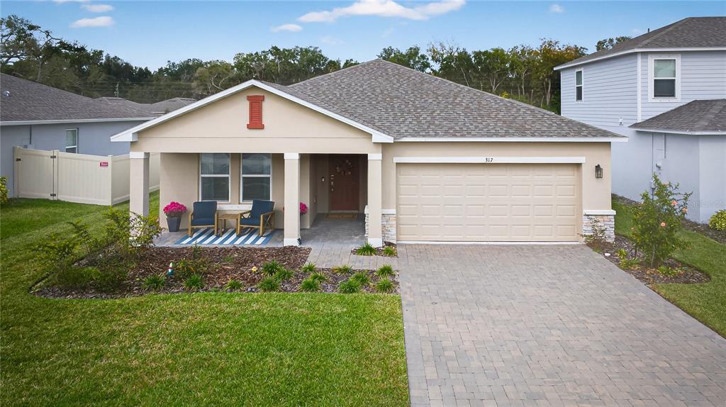 317 Riverfront Way Edgewater, FL 32141 - Photo 41 of 63 a view of a house with pool and garden