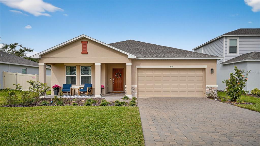 317 Riverfront Way Edgewater, FL 32141 - Photo 46 of 63 front view of a house with a yard