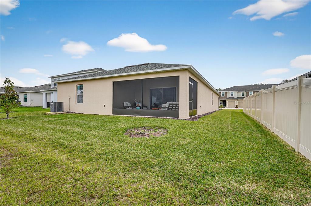 317 Riverfront Way Edgewater, FL 32141 - Photo 50 of 63 a view of a house with backyard