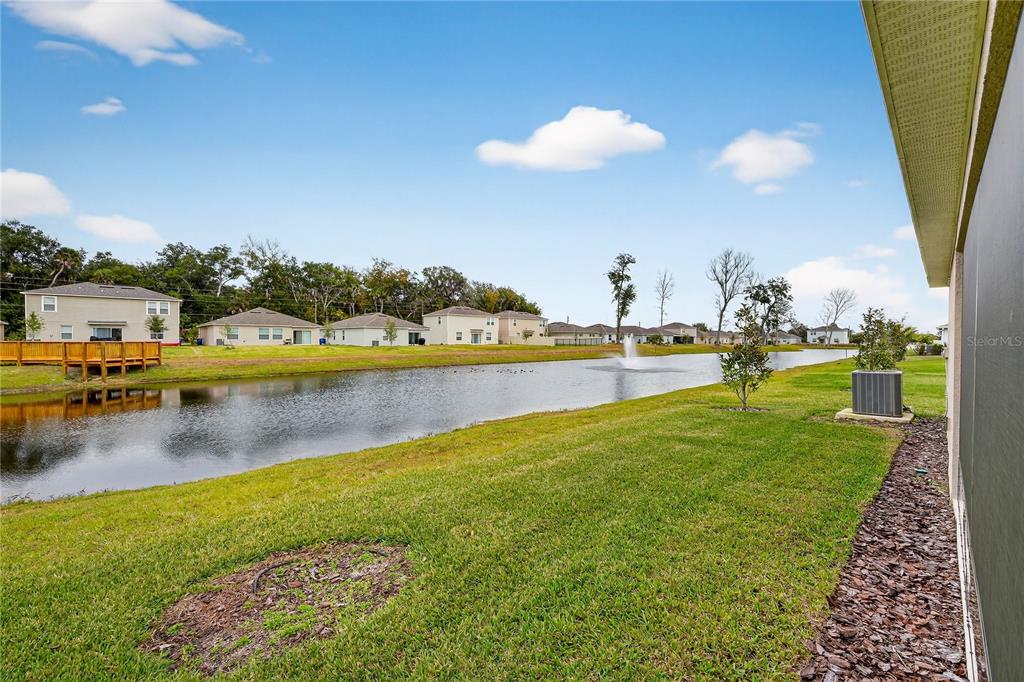 317 Riverfront Way Edgewater, FL 32141 - Photo 51 of 63 a view of a lake with houses