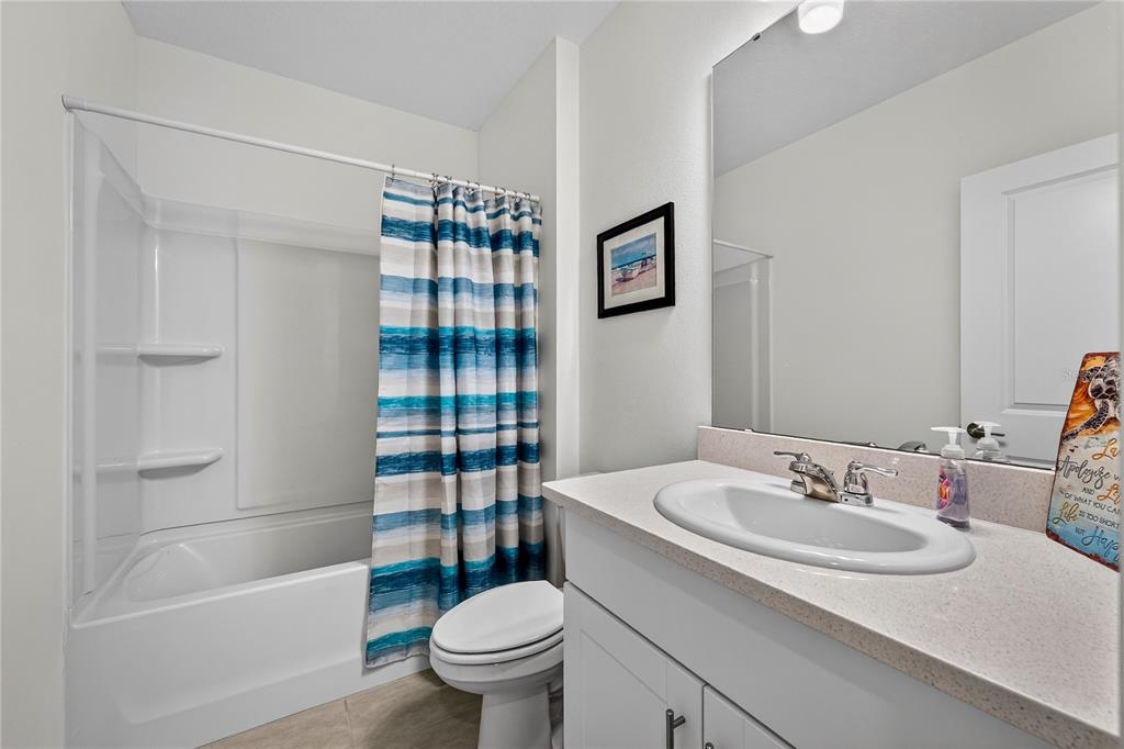 317 Riverfront Way Edgewater, FL 32141 - Photo 6 of 63 a bathroom with a sink toilet and shower