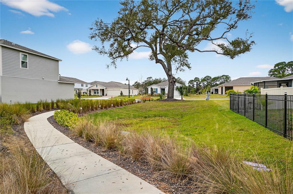 317 Riverfront Way Edgewater, FL 32141 - Photo 63 of 63 a swimming pool with outdoor seating and yard
