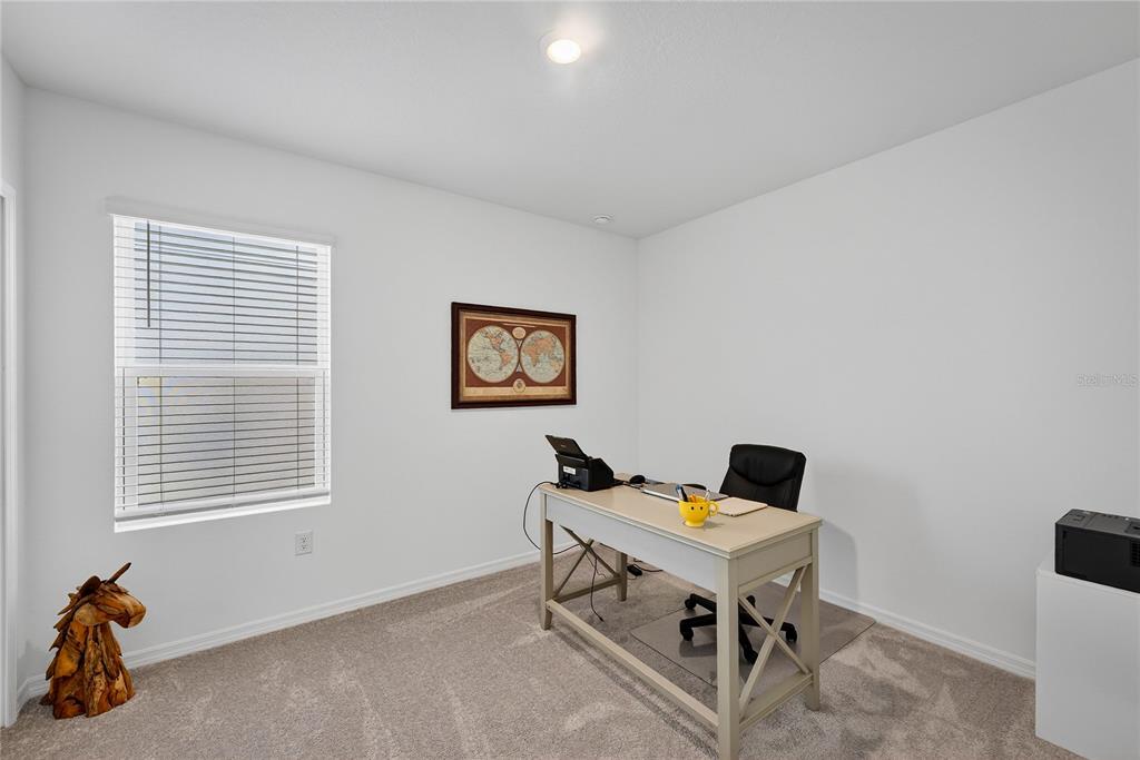 317 Riverfront Way Edgewater, FL 32141 - Photo 8 of 63 a workspace with furniture and a window