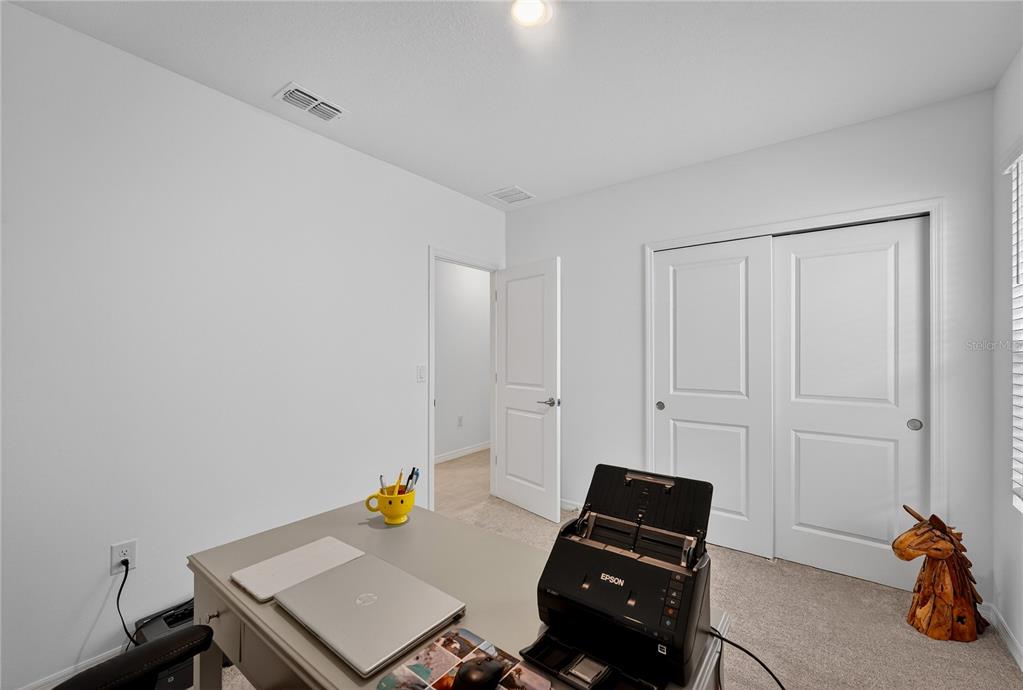 317 Riverfront Way Edgewater, FL 32141 - Photo 9 of 63 a view of a workspace with furniture