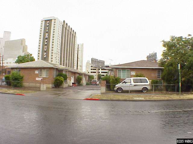 a view of street with parked cars
