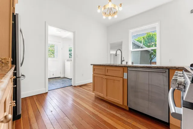 a kitchen with a refrigerator and a sink