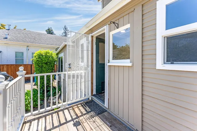 a view of a balcony with wooden floor