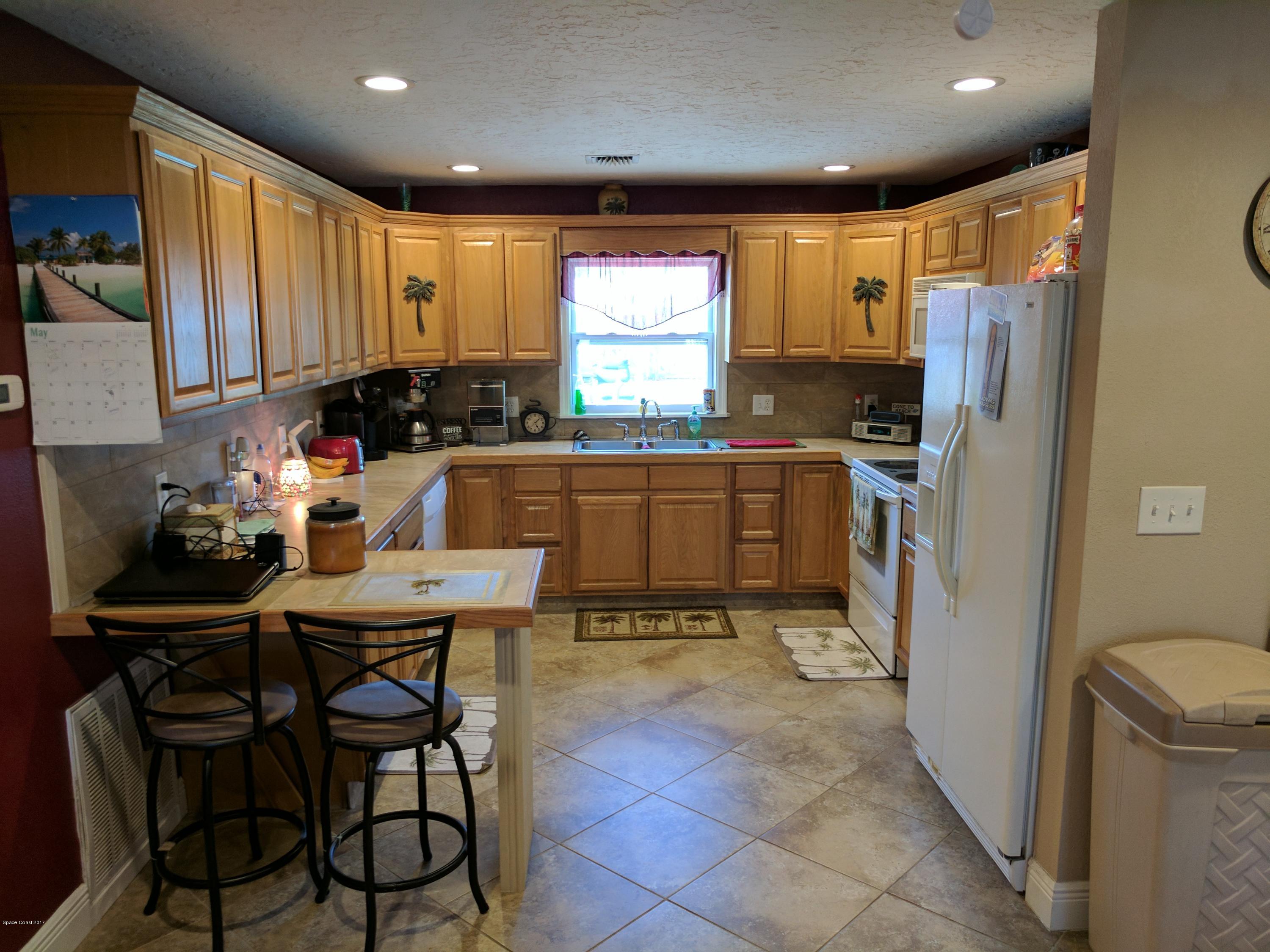 2020 Little John Road Melbourne, FL 32935 - Photo 3 of 29 oak kitchen