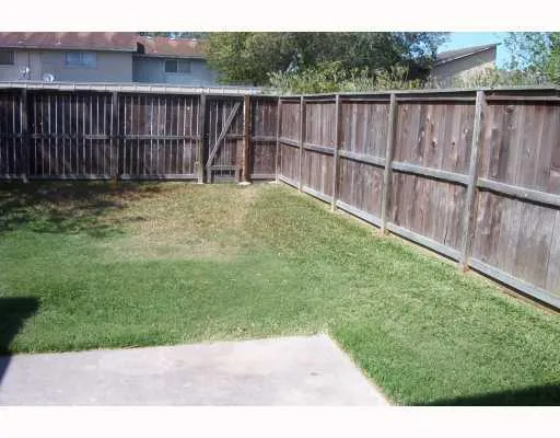 a garden with wooden fence
