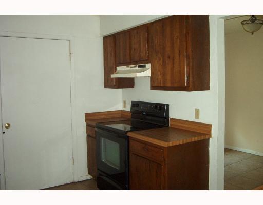 4820 Delwood Street, Unit C6 Corpus Christi, TX 78413 - Photo 4 of 10 a kitchen with a sink and cabinets