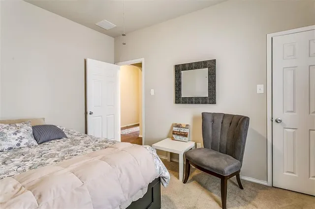 a bathroom with a sink a toilet and shower curtain
