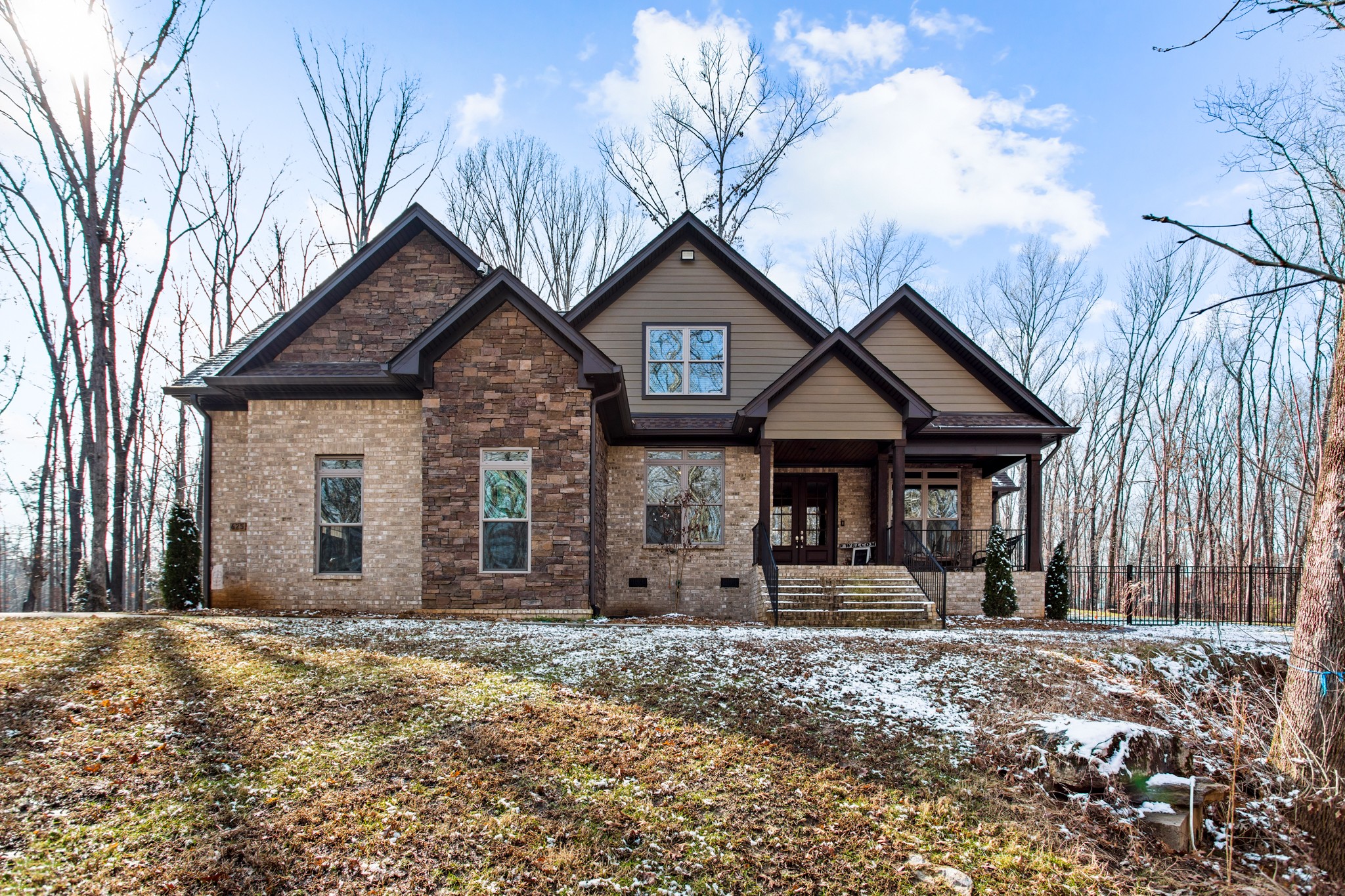 a front view of a house with garden