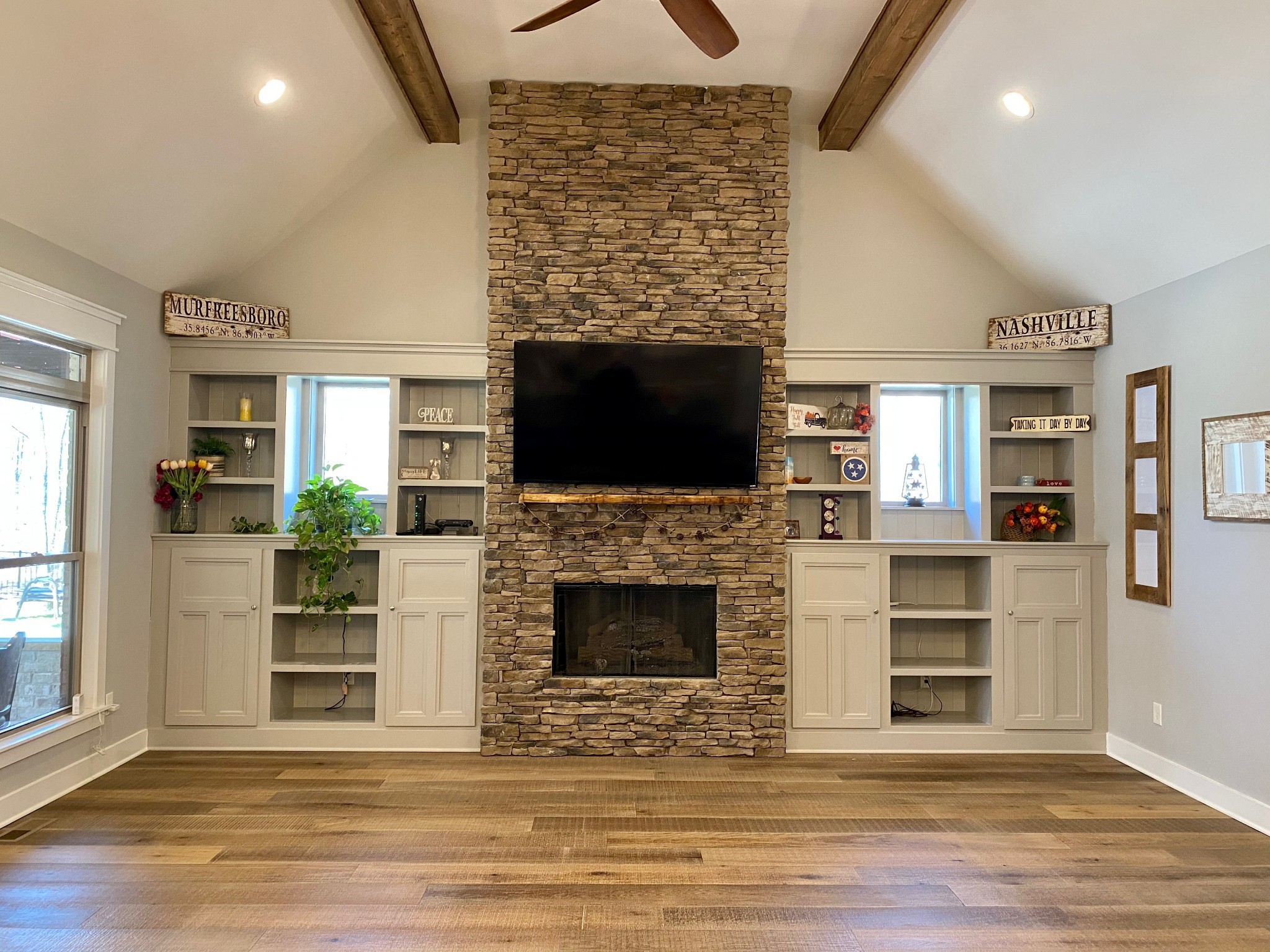 425 Puckett Road Murfreesboro, TN 37128 - Photo 11 of 44 a living room with a fireplace and a flat screen tv