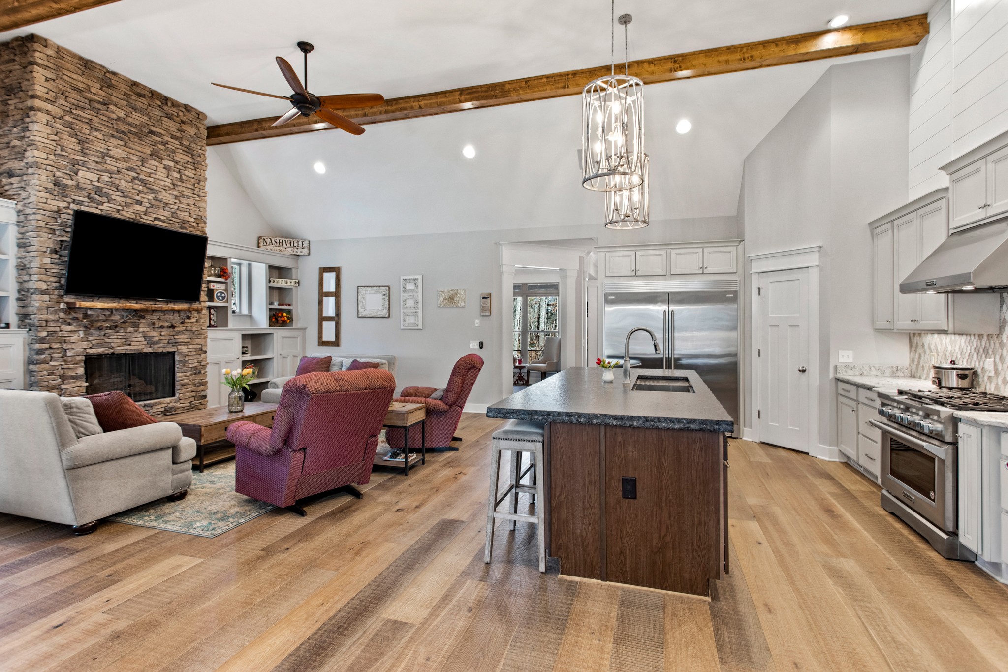 425 Puckett Road Murfreesboro, TN 37128 - Photo 12 of 44 a living room with furniture a flat screen tv and a fireplace