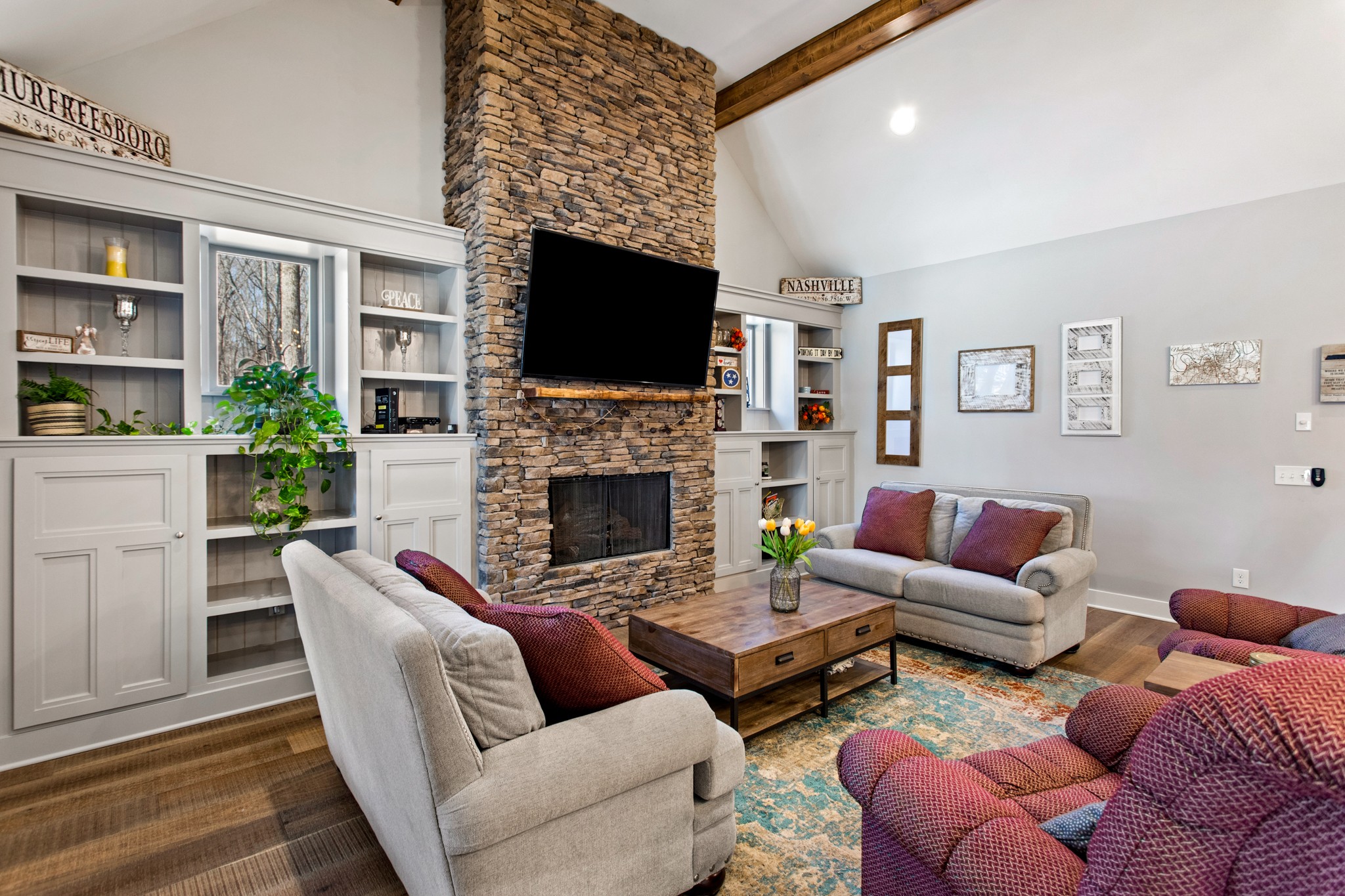 425 Puckett Road Murfreesboro, TN 37128 - Photo 13 of 44 a living room with furniture a flat screen tv and a fireplace